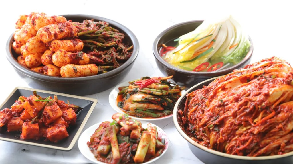 many different types of kimchi: radish, cabbage, green onion and white kimchi after kimchi fermentation